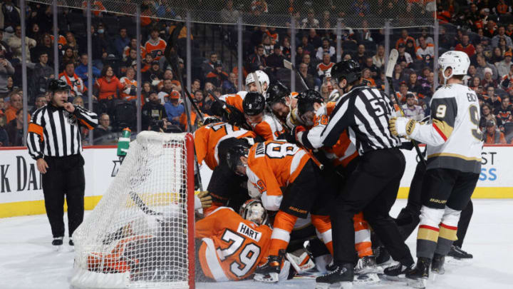 PHILADELPHIA, PENNSYLVANIA - MARCH 08: Philadelphia Flyers and Vegas Golden Knights players challenge for the puck during the first period at Wells Fargo Center on March 08, 2022 in Philadelphia, Pennsylvania. (Photo by Tim Nwachukwu/Getty Images)