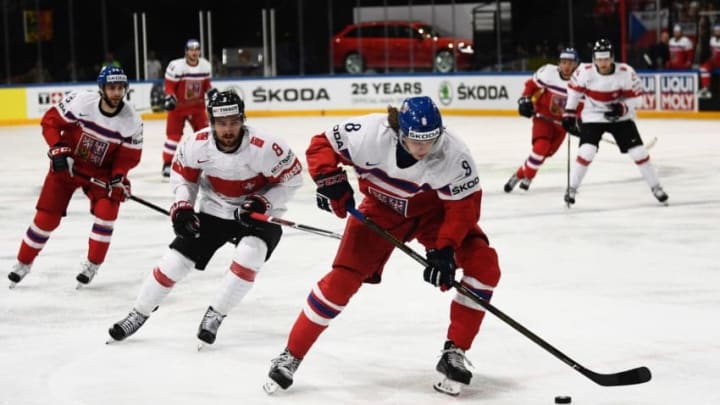 Czech Republic's defender Libor Sulak (R) vies with Switzerland's forward Vincent Praplan (2L) during the IIHF Men's World Championship group B ice hockey match between Czech Republic and Switzerland on May 16, 2017 in Paris. / AFP PHOTO / CHRISTOPHE SIMON (Photo credit should read CHRISTOPHE SIMON/AFP/Getty Images)