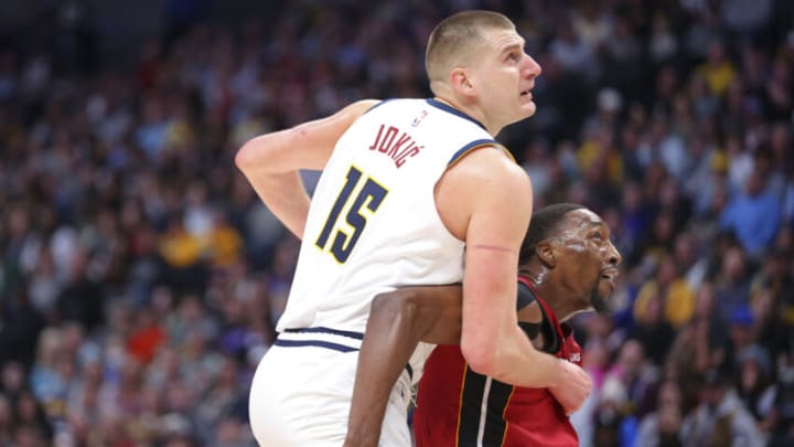 Bam Adebayo #13 of the Miami Heat boxes out Nikola Jokic #15 of the Denver Nuggets (Photo by C. Morgan Engel/Getty Images)