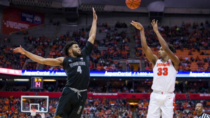 SYRACUSE, NY - DECEMBER 08: Elijah Hughes #33 of the Syracuse Orange shoots the ball during the second half against Jagan Mosely #4 of the Georgetown Hoyas at the Carrier Dome on December 8, 2018 in Syracuse, New York. Syracuse defeated Georgetown 72-71. (Photo by Brett Carlsen/Getty Images)
