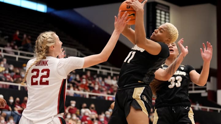 Feb 13, 2022; Stanford, California, USA; Colorado Buffaloes center Quay Miller (11) grabs a rebound over Stanford Cardinal forward Cameron Brink (22) during the second quarter at Maples Pavilion. Mandatory Credit: Darren Yamashita-USA TODAY Sports