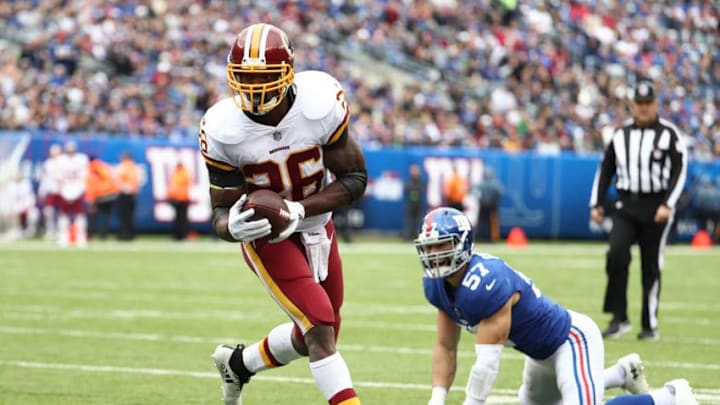 EAST RUTHERFORD, NJ - OCTOBER 28: Adrian Peterson #26 of the Washington Redskins scores a touchdown against Nate Stupar #57 of the New York Giants during their game at MetLife Stadium on October 28, 2018 in East Rutherford, New Jersey. (Photo by Al Bello/Getty Images)