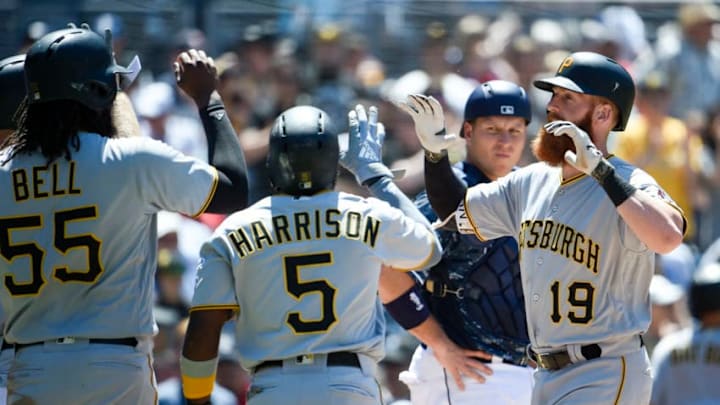 SAN DIEGO, CA - JULY 1: Colin Moran #19 of the Pittsburgh Pirates, right, is congratulated by Josh Bell #55 and Josh Harrison #5 after hitting a grand slam during the fifth inning of a baseball game against the San Diego Padres at PETCO Park on July 1, 2018 in San Diego, California. (Photo by Denis Poroy/Getty Images)