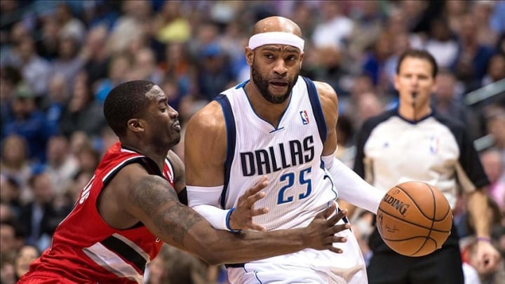 Mar 7, 2014; Dallas, TX, USA; Portland Trail Blazers shooting guard Wesley Matthews (2) defends against Dallas Mavericks shooting guard Vince Carter (25) during the first half at the American Airlines Center. Mandatory Credit: Jerome Miron-USA TODAY Sports