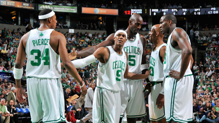 Boston Celtics 2008 championship starters huddle together during a game.