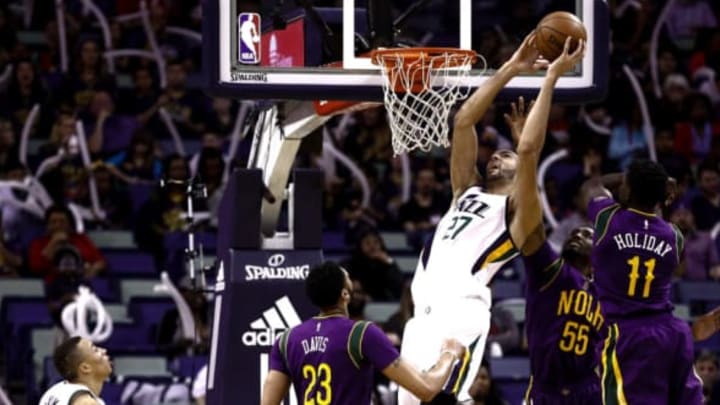 Feb 8, 2017; New Orleans, LA, USA; Utah Jazz center Rudy Gobert (27) shoots over New Orleans Pelicans guard E’Twaun Moore (55) and guard Jrue Holiday (11) and forward Anthony Davis (23) during the first quarter of a game at the Smoothie King Center. Mandatory Credit: Derick E. Hingle-USA TODAY Sports