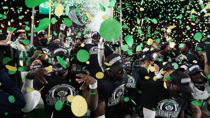 Dec 18, 2020; Los Angeles, California, USA; Oregon Ducks players celebrate after the Pac-12 Championship at United Airlines Field against the Southern California Trojans at Los Angeles Memorial Coliseum. Oregon defeated USC 31-24. Mandatory Credit: Kirby Lee-USA TODAY Sports