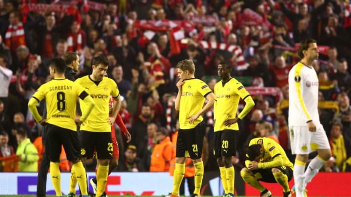 LIVERPOOL, ENGLAND - APRIL 14: Dortmund players look dejected after the UEFA Europa League quarter final, second leg match between Liverpool and Borussia Dortmund at Anfield on April 14, 2016 in Liverpool, United Kingdom. (Photo by Clive Brunskill/Getty Images)