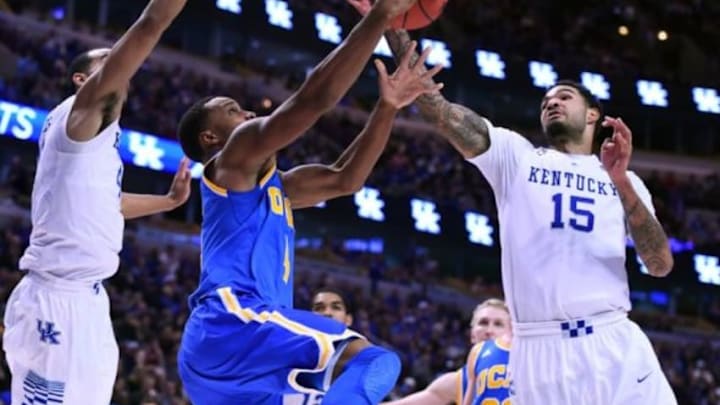Dec 20, 2014; Chicago, IL, USA; UCLA Bruins guard Norman Powell (4) attempts to shoot the ball against Kentucky Wildcats forward Willie Cauley-Stein (15) during the second half at United Center. Kentucky defeats UCLA 83-42. Mandatory Credit: Mike DiNovo-USA TODAY Sports