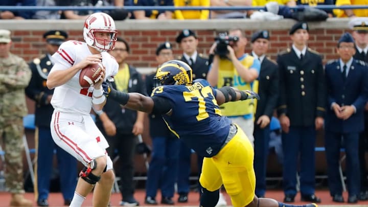 ANN ARBOR, MI - OCTOBER 01: Maurice Hurst #73 of the Michigan Wolverines rushes quarterback Alex Hornibrook #12 of the Wisconsin Badgers during the second quarter of the game at Michigan Stadium on October 1, 2016 in Ann Arbor, Michigan. (Photo by Leon Halip/Getty Images) ANN ARBOR, MI - OCTOBER 01: Maurice Hurst #73 of the Michigan Wolverines rushes quarterback Alex Hornibrook #12 of the Wisconsin Badgers during the second quarter of the game at Michigan Stadium on October 1, 2016 in Ann Arbor, Michigan. (Photo by Leon Halip/Getty Images)