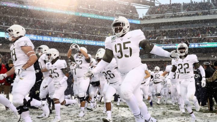 PHILADELPHIA, PA - DECEMBER 09: Emmanuel Ukhueligbe #95 of the Army Black Knights and the rest of his teammates run out on the field before the game against the Navy Midshipmen on December 9, 2017 at Lincoln Financial Field in Philadelphia, Pennsylvania. (Photo by Elsa/Getty Images)