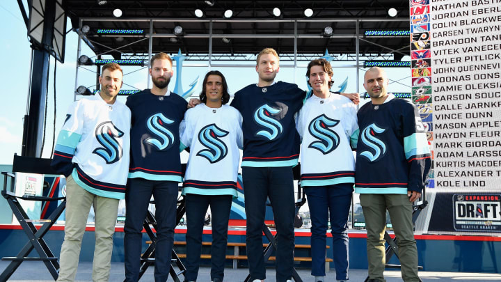 SEATTLE, WASHINGTON – JULY 21: The Seattle Kracken draft picks (L-R) Jordan Eberle, Chris Driedger, Chris Tanev, Jamie Oleksiak, Haydn Fleury and Mark Giordano following the 2021 NHL Expansion Draft at Gas Works Park on July 21, 2021 in Seattle, Washington. The Seattle Kraken is the National Hockey League’s newest franchise and will begin play in October 2021. (Photo by Alika Jenner/Getty Images)