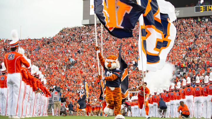 AUBURN, AL - SEPTEMBER 28: The Auburn Tigers cheerleaders run out on to the field prior to their game against the Mississippi State Bulldogs at Jordan-Hare Stadium on September 28, 2019 in Auburn, AL. (Photo by Michael Chang/Getty Images)