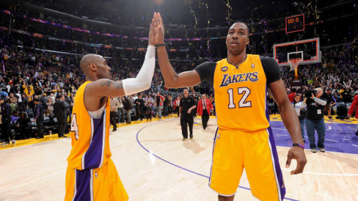 LOS ANGELES, CA - FEBRUARY 22: Kobe Bryant #24 and Dwight Howard #12 of the Los Angeles Lakers celebrate after their team's victory against the Portland Trail Blazers at Staples Center on February 22, 2013 in Los Angeles, California. NOTE TO USER: User expressly acknowledges and agrees that, by downloading and/or using this Photograph, user is consenting to the terms and conditions of the Getty Images License Agreement. Mandatory Copyright Notice: Copyright 2013 NBAE (Photo by Andrew D. Bernstein/NBAE via Getty Images)