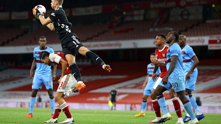 LONDON, ENGLAND – SEPTEMBER 19: Bernd Leno of Arsenal catches the ball above Dani Ceballos of Arsenal during the Premier League match between Arsenal and West Ham United at Emirates Stadium on September 19, 2020, in London, England. (Photo by Julian Finney/Getty Images).