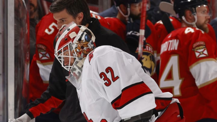 SUNRISE, FL - NOVEMBER 6: Goaltender Antti Raanta #32 of the Carolina Hurricanes is assisted off the ice after being injured in a collision against the Florida Panthers at the FLA Live Arena on November 6, 2021 in Sunrise, Florida. (Photo by Joel Auerbach/Getty Images)