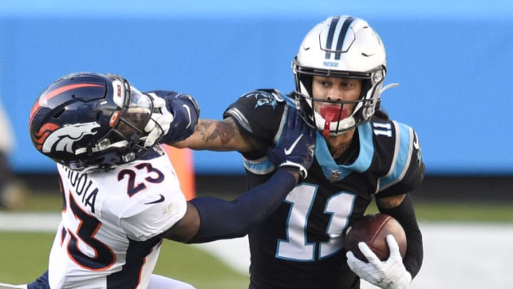 Dec 13, 2020; Charlotte, North Carolina, USA; Carolina Panthers wide receiver Robby Anderson (11) with the ball as Denver Broncos cornerback Michael Ojemudia (23) defends in the fourth quarter at Bank of America Stadium. Mandatory Credit: Bob Donnan-USA TODAY Sports