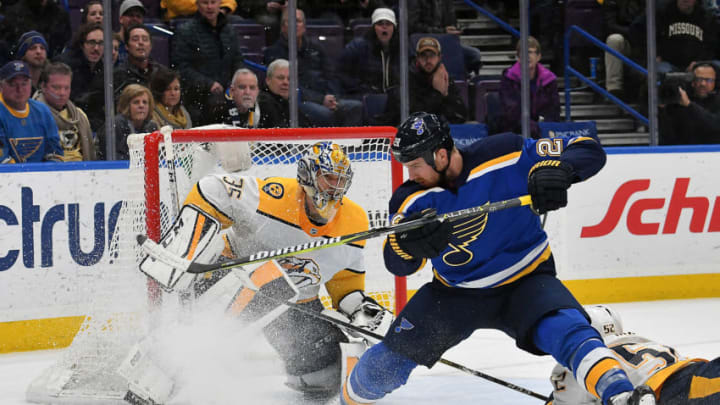 ST. LOUIS, MO - DECEMBER 27: St. Louis Blues center Kyle Brodziak (28) collides with Nashville Predators goalie Pekka Rinne (35) after a shot on goal in the third period period during a NHL game between the Nashville Predators and the St. Louis Blues on December 27, 2017, at Scottrade Center, St. Louis, MO. Nashville won, 2-1. (Photo by Keith Gillett/Icon Sportswire via Getty Images)