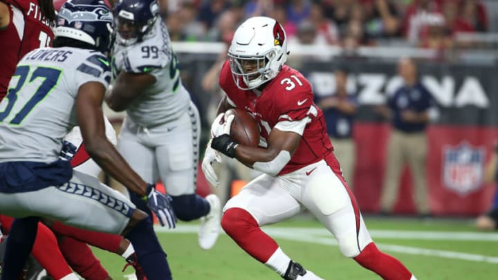 GLENDALE, AZ - SEPTEMBER 30: Running back David Johnson #31 of the Arizona Cardinals runs with the ball during an NFL game against the Seattle Seahawks at State Farm Stadium on September 30, 2018 in Glendale, Arizona. (Photo by Ralph Freso/Getty Images)