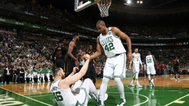 BOSTON, MA - MAY 27: Al Horford #42 helps Aron Baynes #46 of the Boston Celtics from the floor during Game Seven of the Eastern Conference Finals of the 2018 NBA Playoffs between the Cleveland Cavaliers and Boston Celtics on May 27, 2018 at the TD Garden in Boston, Massachusetts. NOTE TO USER: User expressly acknowledges and agrees that, by downloading and or using this photograph, User is consenting to the terms and conditions of the Getty Images License Agreement. Mandatory Copyright Notice: Copyright 2018 NBAE (Photo by Brian Babineau/NBAE via Getty Images)