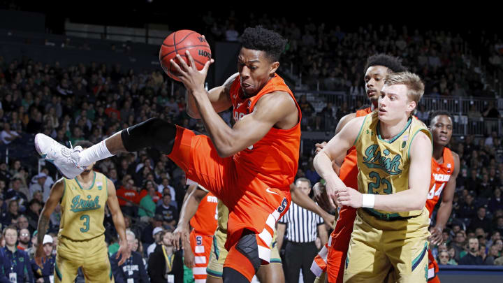 SOUTH BEND, IN – JANUARY 05: Tyus Battle #25 of the Syracuse Orange grabs a rebound against Dane Goodwin #23 of the Notre Dame Fighting Irish in the second half of the game at Purcell Pavilion on January 5, 2019 in South Bend, Indiana. Syracuse won 72-62. (Photo by Joe Robbins/Getty Images)