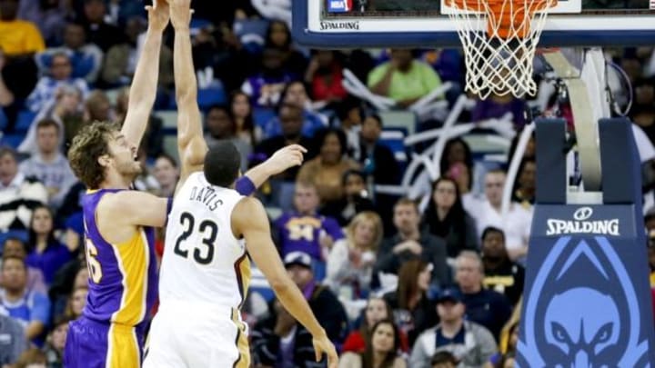 Nov 8, 2013; New Orleans, LA, USA; New Orleans Pelicans power forward Anthony Davis (23) blocks a shot by Los Angeles Lakers center Pau Gasol (16) during the second quarter of a game at New Orleans Arena. Mandatory Credit: Derick E. Hingle-USA TODAY Sports