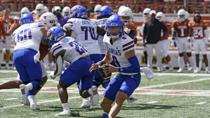 Sep 30, 2023; Austin, Texas, USA; Kansas Jayhawks quarterback Jason Bean (9) scans the field during the first half against the Texas Longhorns at Darrell K Royal-Texas Memorial Stadium. Mandatory Credit: Scott Wachter-USA TODAY Sports