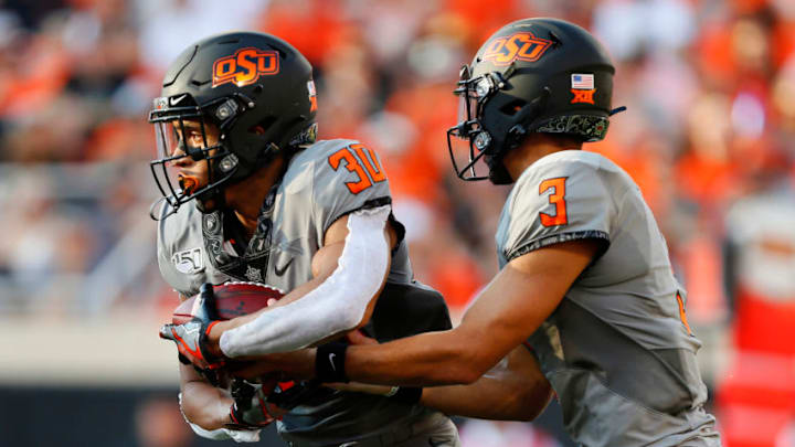 Chuba Hubbard, Spencer Sanders, Oklahoma State Cowboys. (Photo by Brian Bahr/Getty Images)