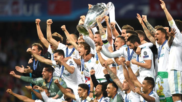 KIEV, UKRAINE - MAY 26: Sergio Ramos of Real Madrid lifts The UEFA Champions League trophy as his teammates celebrate following their sides victory in the UEFA Champions League Final between Real Madrid and Liverpool at NSC Olimpiyskiy Stadium on May 26, 2018 in Kiev, Ukraine. (Photo by Michael Regan/Getty Images)
