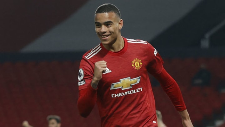 Manchester United's English striker Mason Greenwood celebrates scoring his team's second goal during the English Premier League football match between Manchester United and Brighton and Hove Albion at Old Trafford in Manchester, north west England, on April 4, 2021. - RESTRICTED TO EDITORIAL USE. No use with unauthorized audio, video, data, fixture lists, club/league logos or 'live' services. Online in-match use limited to 120 images. An additional 40 images may be used in extra time. No video emulation. Social media in-match use limited to 120 images. An additional 40 images may be used in extra time. No use in betting publications, games or single club/league/player publications. (Photo by PHIL NOBLE / POOL / AFP) / RESTRICTED TO EDITORIAL USE. No use with unauthorized audio, video, data, fixture lists, club/league logos or 'live' services. Online in-match use limited to 120 images. An additional 40 images may be used in extra time. No video emulation. Social media in-match use limited to 120 images. An additional 40 images may be used in extra time. No use in betting publications, games or single club/league/player publications. / RESTRICTED TO EDITORIAL USE. No use with unauthorized audio, video, data, fixture lists, club/league logos or 'live' services. Online in-match use limited to 120 images. An additional 40 images may be used in extra time. No video emulation. Social media in-match use limited to 120 images. An additional 40 images may be used in extra time. No use in betting publications, games or single club/league/player publications. (Photo by PHIL NOBLE/POOL/AFP via Getty Images)