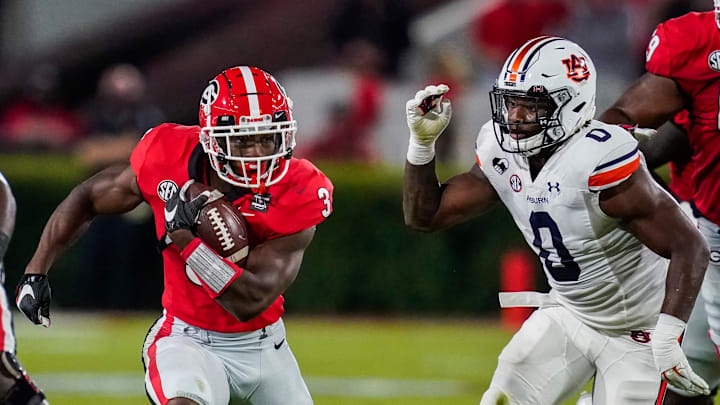 Oct 3, 2020; Athens, Georgia, USA; Georgia Bulldogs running back Zamir White (3) runs against Auburn Tigers linebacker Owen Pappoe (0) during the first half at Sanford Stadium. Mandatory Credit: Dale Zanine-USA TODAY Sports