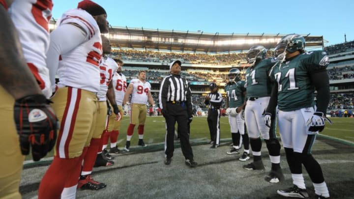 Referee Don Carey flips the coin during the game between the Philadelphia Eagles and the San Francisco 49ers (Photo by Drew Hallowell/Getty Images)