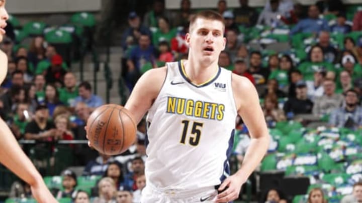 Denver Nuggets v Dallas MavericksDALLAS, TX – MARCH 6: Nikola Jokic #15 of the Denver Nuggets handles the ball during the game against the Dallas Mavericks on March 6, 2018 at the American Airlines Center in Dallas, Texas. NOTE TO USER: User expressly acknowledges and agrees that, by downloading and or using this photograph, User is consenting to the terms and conditions of the Getty Images License Agreement. Mandatory Copyright Notice: Copyright 2018 NBAE (Photo by Danny Bollinger/NBAE via Getty Images)Getty ID: 928303068