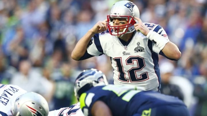 Feb 1, 2015; Glendale, AZ, USA; New England Patriots quarterback Tom Brady (12) reacts against the Seattle Seahawks in Super Bowl XLIX at University of Phoenix Stadium. Mandatory Credit: Mark J. Rebilas-USA TODAY Sports