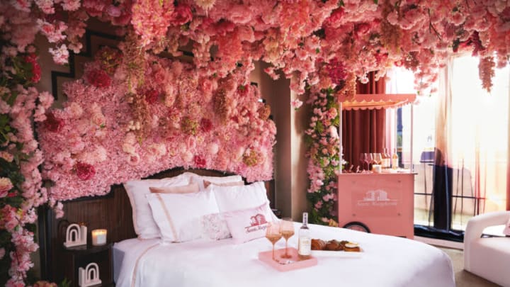 World's first Rosé-All-Day suite, designed to feel like you are in Italy with 50,000+ pink petals, Rosé butler + more. Image Courtesy of Walker Hotel