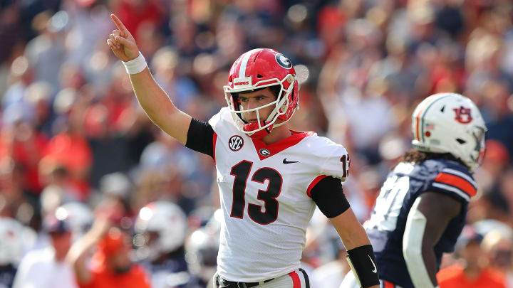 AUBURN, ALABAMA – OCTOBER 09: Stetson Bennett #13 of the Georgia Bulldogs reacts after a touchdown against the Auburn Tigers during the first half at Jordan-Hare Stadium on October 09, 2021 in Auburn, Alabama. (Photo by Kevin C. Cox/Getty Images)