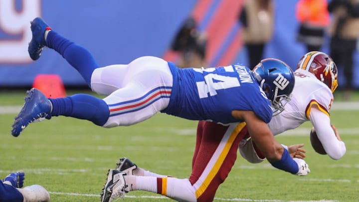 EAST RUTHERFORD, NJ - DECEMBER 31: Olivier Vernon #54 of the New York Giants sacks Kirk Cousins #8 of the Washington Redskins during the second half at MetLife Stadium on December 31, 2017 in East Rutherford, New Jersey. The Giants defeated the Redskins 18-10. (Photo by Ed Mulholland/Getty Images)