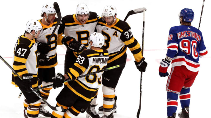BOSTON - MARCH 27: Boston Bruins right wing David Pastrnak (88) and teammates celebrate after Pastrnak put the Bruins on the board with a power play goal during the first period. The Boston Bruins host the New York Rangers in a regular season NHL hockey game at TD Garden in Boston on March 27, 2019. (Photo by Barry Chin/The Boston Globe via Getty Images)