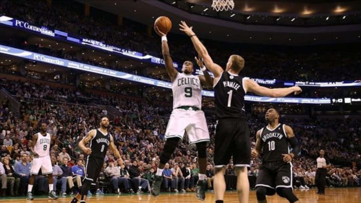 Mar 7, 2014; Boston, MA, USA; Boston Celtics point guard Rajon Rondo (9) goes for a shot in the lane over Brooklyn Nets power forward Mason Plumlee (1) during the second half of Boston’s 91-84 win at TD Garden. Mandatory Credit: Winslow Townson-USA TODAY Sports