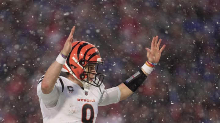 ORCHARD PARK, NY - JANUARY 22: Joe Burrow #9 of the Cincinnati Bengals celebrates after scoring a touchdown against the Buffalo Bills during the second half at Highmark Stadium on January 22, 2023 in Orchard Park, New York. (Photo by Cooper Neill/Getty Images)