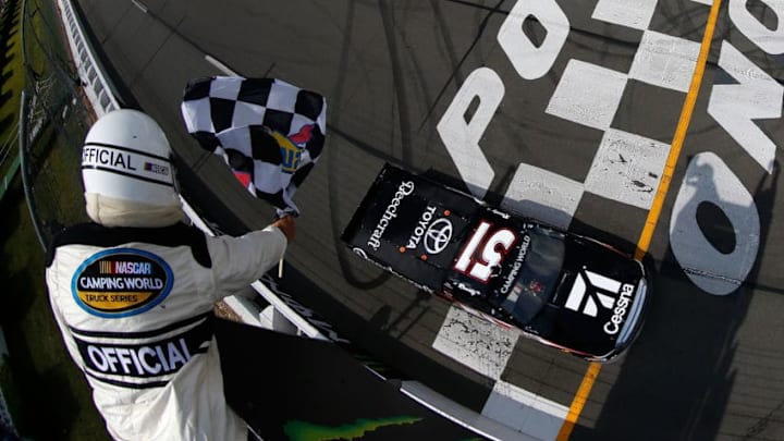 LONG POND, PA - JULY 28: Kyle Busch, driver of the #51 Cessna Toyota, crosses the finish line to win the NASCAR Camping World Truck Series Gander Outdoors 150 at Pocono Raceway on July 28, 2018 in Long Pond, Pennsylvania. (Photo by Chris Trotman/Getty Images) LONG POND, PA - JULY 28: Kyle Busch, driver of the #51 Cessna Toyota, crosses the finish line to win the NASCAR Camping World Truck Series Gander Outdoors 150 at Pocono Raceway on July 28, 2018 in Long Pond, Pennsylvania. (Photo by Chris Trotman/Getty Images)