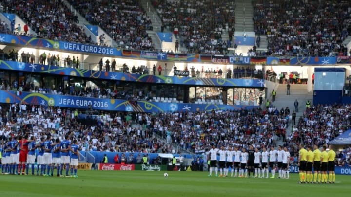BORDEAUX, FRANCE - JULY 2: Players and Fans stand in silence for the victims of the Istanbul Ataturk Airport terror attack, prior to the UEFA Euro 2016 quarter final match between Germany and Italy at Stade de Bordeaux in Bordeaux, France on July 2, 2016. (Photo by Metin Pala/Anadolu Agency/Getty Images)
