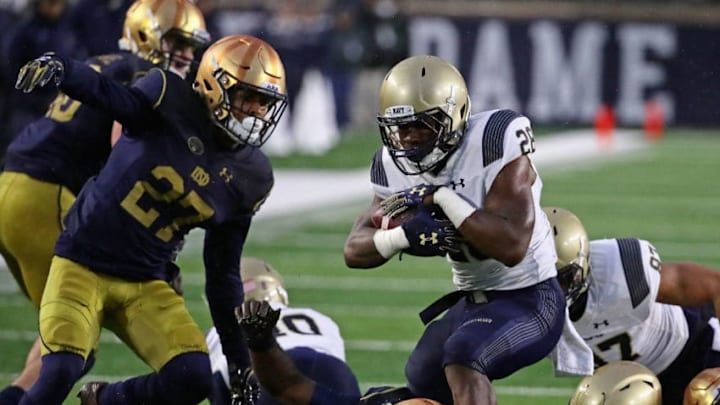 SOUTH BEND, IN - NOVEMBER 18: Josh Brown #28 of the Navy Midshipmen runs over Shaun Crawford #20 of the Notre Dame Fighting Irish at Notre Dame Stadium on November 18, 2017 in South Bend, Indiana. (Photo by Jonathan Daniel/Getty Images)