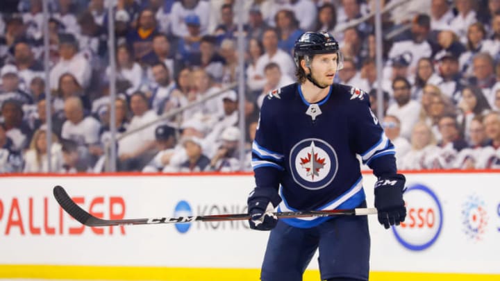 WINNIPEG, MB - APRIL 12: Jacob Trouba #8 of the Winnipeg Jets keeps an eye on the play during first period action against the St. Louis Blues in Game Two of the Western Conference First Round during the 2019 NHL Stanley Cup Playoffs at the Bell MTS Place on April 12, 2019 in Winnipeg, Manitoba, Canada. The Blues defeated the Jets 4-3 to lead the series 2-0. (Photo by Darcy Finley/NHLI via Getty Images)