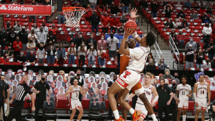 Feb 27, 2021; Lubbock, Texas, USA; Texas Tech Red Raiders guard Terrence Shannon Jr. (1) goes to the basket against Texas Longhorns guard Matt Coleman III (2) in the second half at United Supermarkets Arena. Mandatory Credit: Michael C. Johnson-USA TODAY Sports