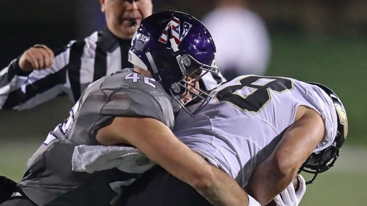 EVANSTON, IL – NOVEMBER 11: Paddy Fisher #42 of the Northwestern Wildcats tackloes Cole Herdman #88 of the Purdue Boilermakers at Ryan Field on November 11, 2017 in Evanston, Illinois. (Photo by Jonathan Daniel/Getty Images)