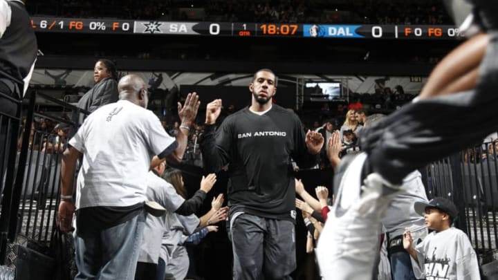 SAN ANTONIO, TX - NOVEMBER 25: LaMarcus Aldridge #12 of the San Antonio Spurs gets introduced before the game against the Dallas Mavericks on November 25, 2015 at the AT&T Center in San Antonio, Texas. NOTE TO USER: User expressly acknowledges and agrees that, by downloading and or using this photograph, user is consenting to the terms and conditions of the Getty Images License Agreement. Mandatory Copyright Notice: Copyright 2015 NBAE (Photos by Chris Covatta/NBAE via Getty Images)