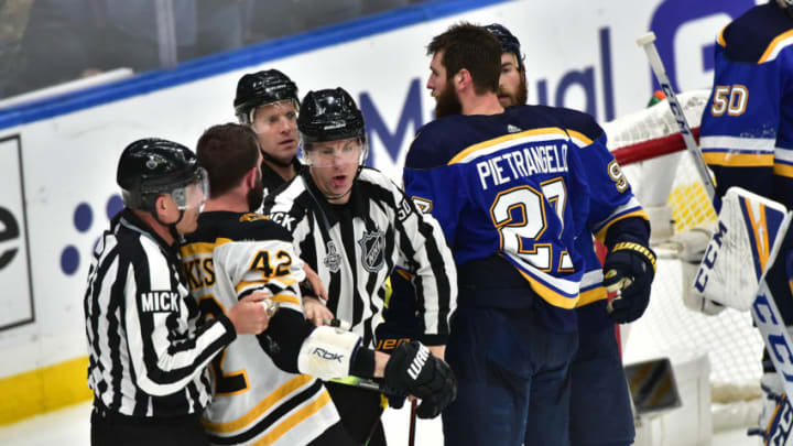 ST. LOUIS, MO - JUN 03: Game officials separate Boston Bruins rightwing David Backes (42) and St. Louis Blues defenseman Alex Pietrangelo (27) late in the game during Game 4 of the Stanley Cup Final between the Boston Bruins and the St. Louis Blues, on June 01, 2019, at Enterprise Center, St. Louis, Mo. (Photo by Keith Gillett/Icon Sportswire via Getty Images)