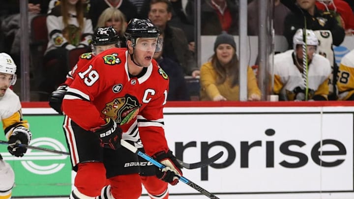 CHICAGO, ILLINOIS - DECEMBER 12: Jonathan Toews #19 of the Chicago Blackhawks passes against the Pittsburgh Penguins at the United Center on December 12, 2018 in Chicago, Illinois. The Blackhawks defeated the Penguins 6-3. (Photo by Jonathan Daniel/Getty Images)