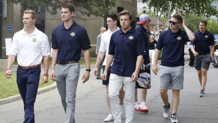 BUFFALO, NY - JUNE 23: NHL draft prospects Jakob Chychrun, Logan Brown, Pierre-Luc Dubois, Charles McAvoy, Patrik Laine, Matthew Tkachuk and Jesse Puljujarvi (L-R) arrive at the Top Prospects Media Availability portion of the 2016 NHL Draft at the Erie Basin Marina on June 23, 2016 in Buffalo, New York. (Photo by Jen Fuller/Getty Images)